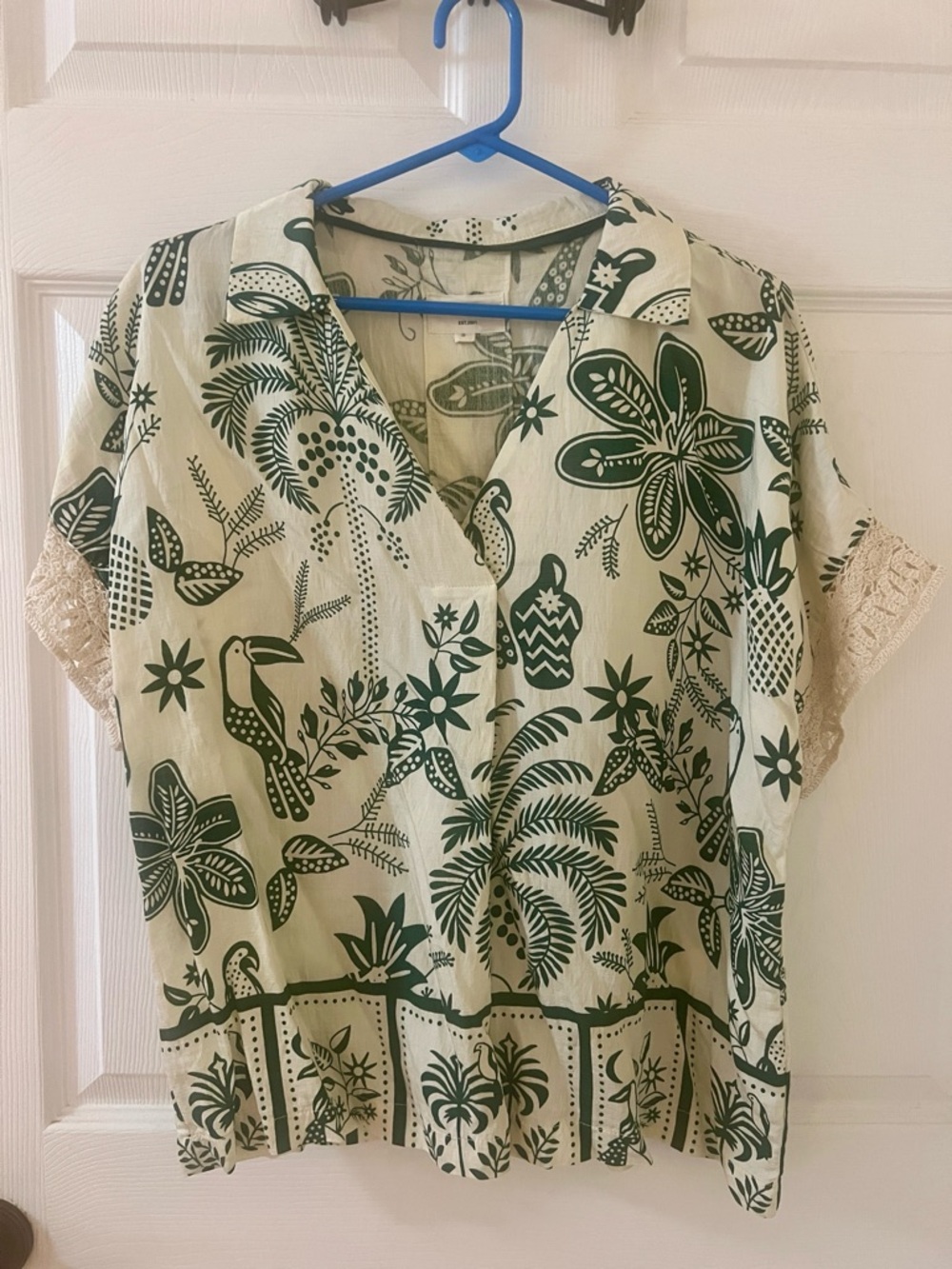 Umgee Cream Short Sleeve Tropical Print Top with Dark Green Motifs